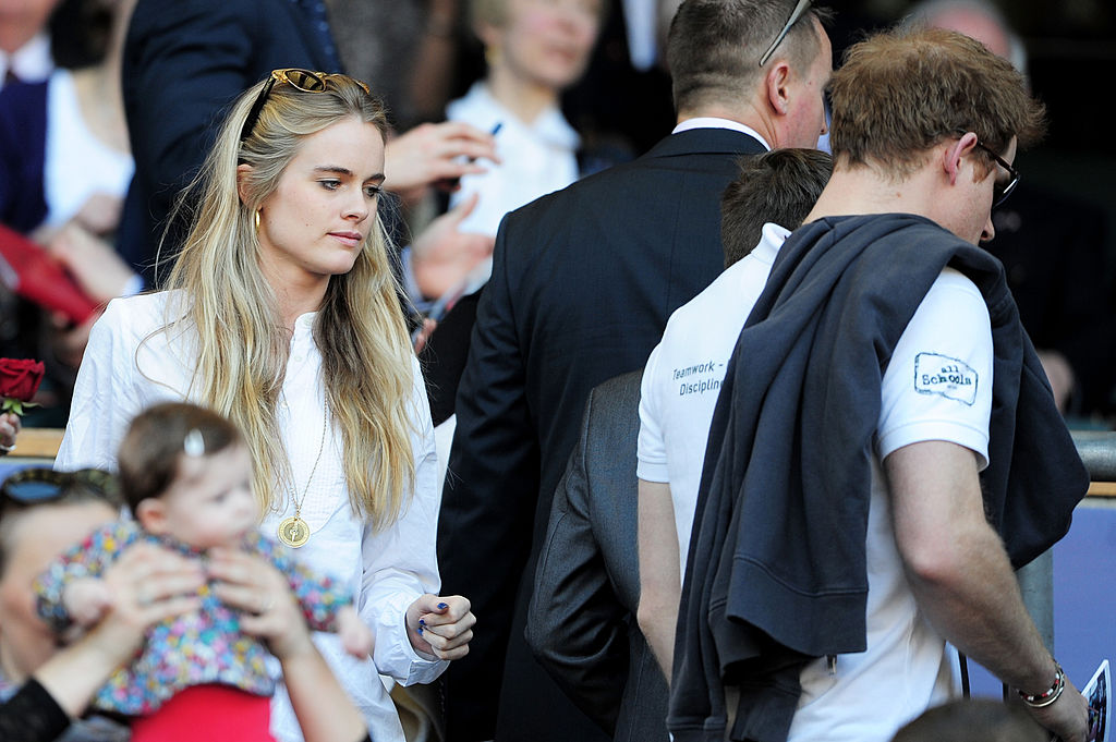 LONDON, ENGLAND - MARCH 09:  Prince Harry (R) and Cressida Bonas (L) take their seats during the RBS Six Nations match between England and Wales at Twickenham Stadium on March 9, 2014 in London, England.  (Photo by Shaun Botterill/Getty Images)